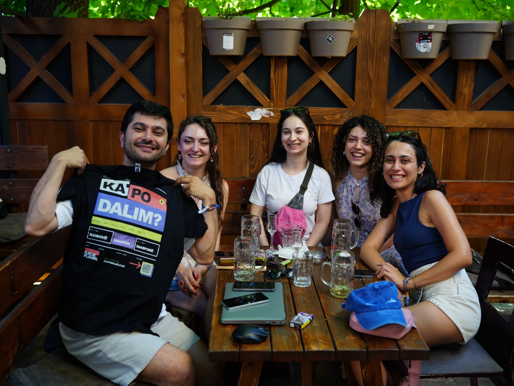 Friends showing the RRUGA 01 T-shirt after receiving it as a gift